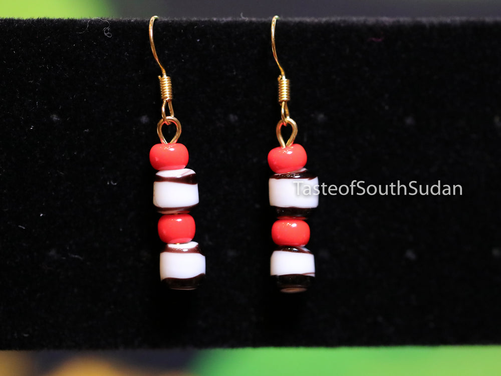 Authentic African Beaded Earrings Red, white and black glass beads.  Made of glass beads.  Hand made by women in South Sudan using traditional beading techniques passed down generations.  Fair trade practices. Your purchase empowers South Sudanese women artisans to provide food, education and medical care for their children. Outrageous Guarantee. Love them or we b